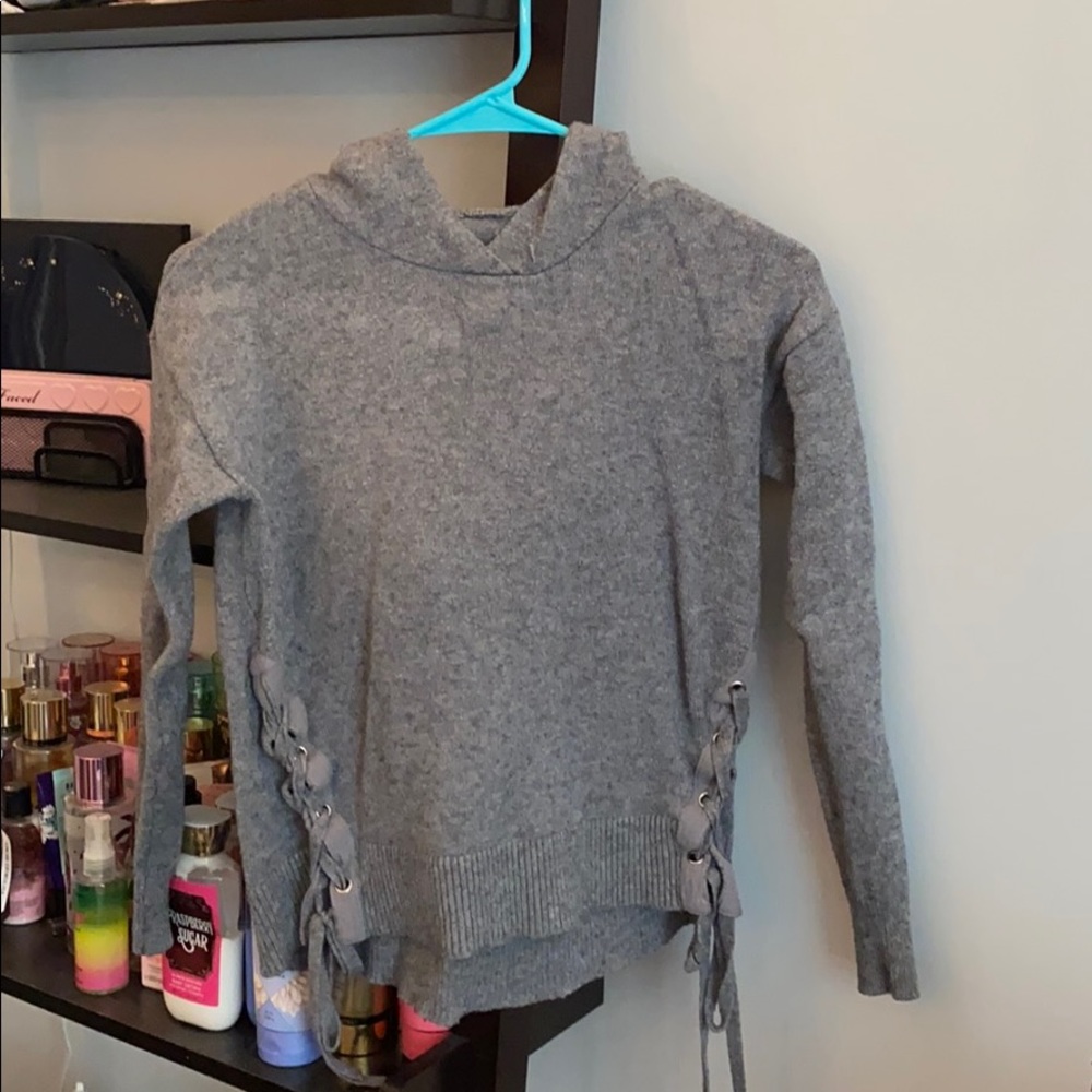 woman’s grey sweater
